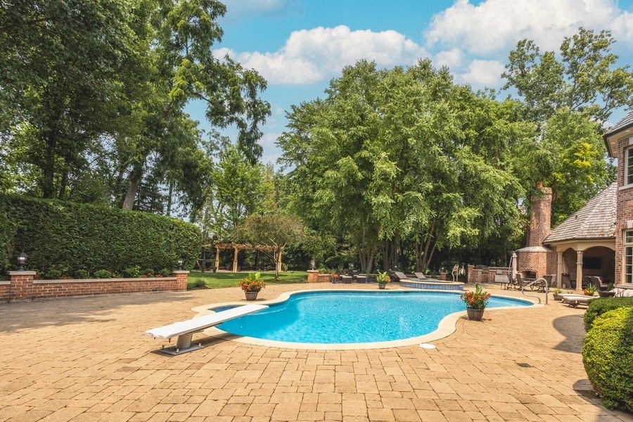 2 Bristol Road Northfield, IL 60093 - Photo 19 of 52 a view of a swimming pool with a patio