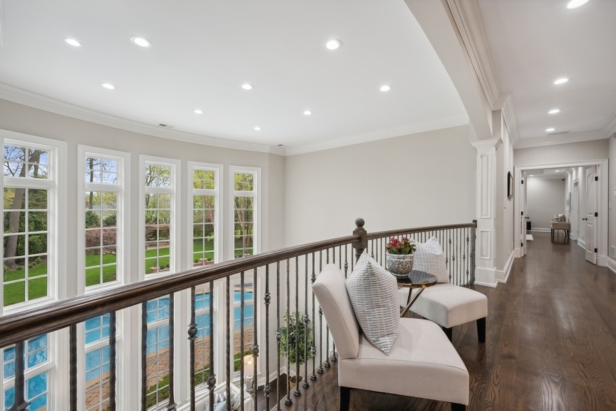 2 Bristol Road Northfield, IL 60093 - Photo 24 of 52 a view of hallway with furniture and wooden floor