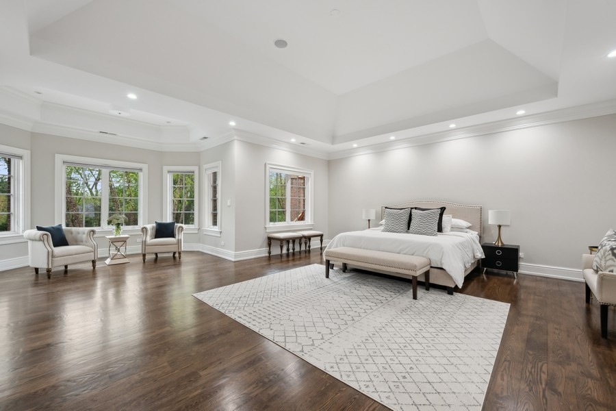 2 Bristol Road Northfield, IL 60093 - Photo 25 of 52 a spacious bedroom with a bed a table and chairs