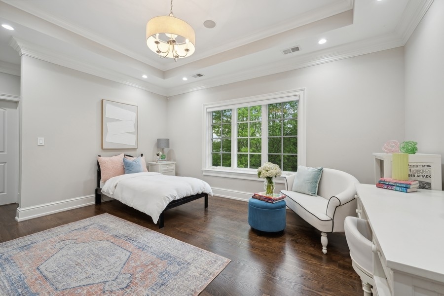 2 Bristol Road Northfield, IL 60093 - Photo 29 of 52 a spacious bedroom with a bed and a couch