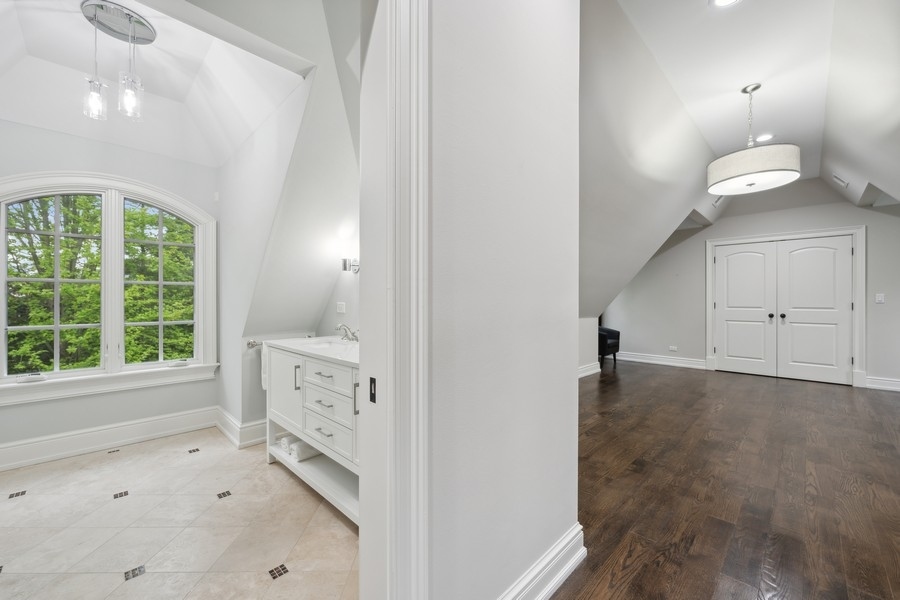 2 Bristol Road Northfield, IL 60093 - Photo 34 of 52 a view of empty room with window and wooden floor
