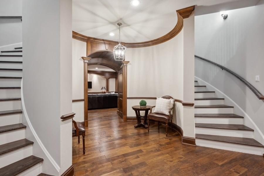 2 Bristol Road Northfield, IL 60093 - Photo 35 of 52 a view of entryway and hall with wooden floor
