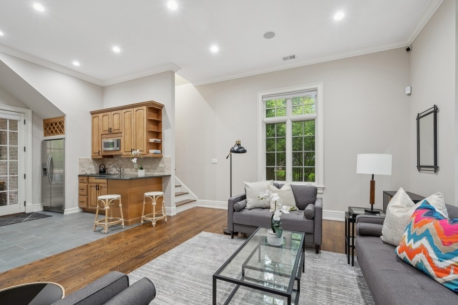 2 Bristol Road Northfield, IL 60093 - Photo 44 of 52 a living room with furniture and a flat screen tv