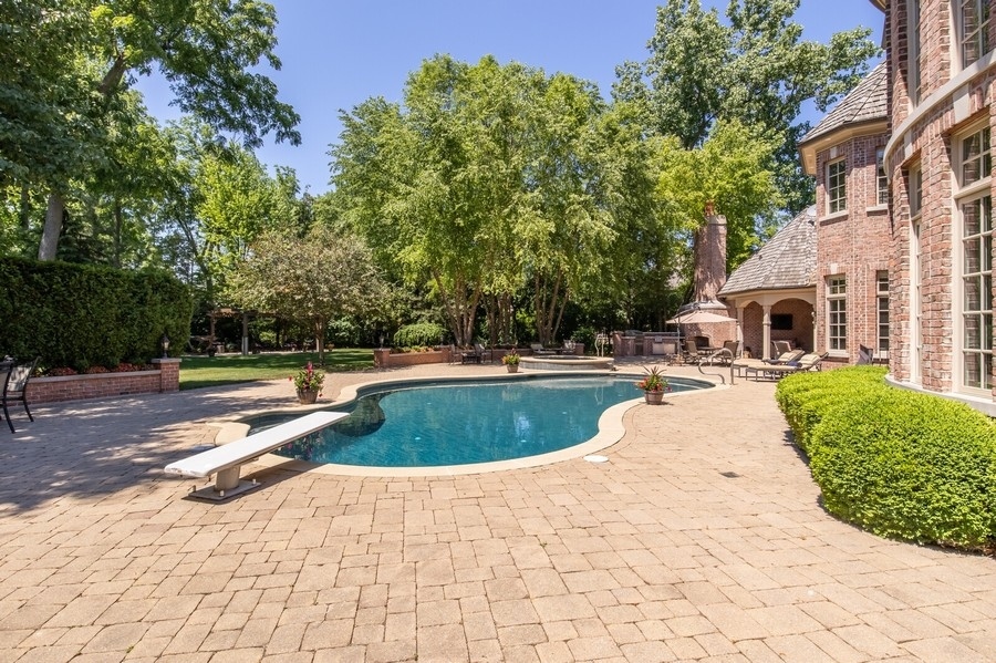 2 Bristol Road Northfield, IL 60093 - Photo 49 of 52 a view of outdoor space yard swimming pool and patio