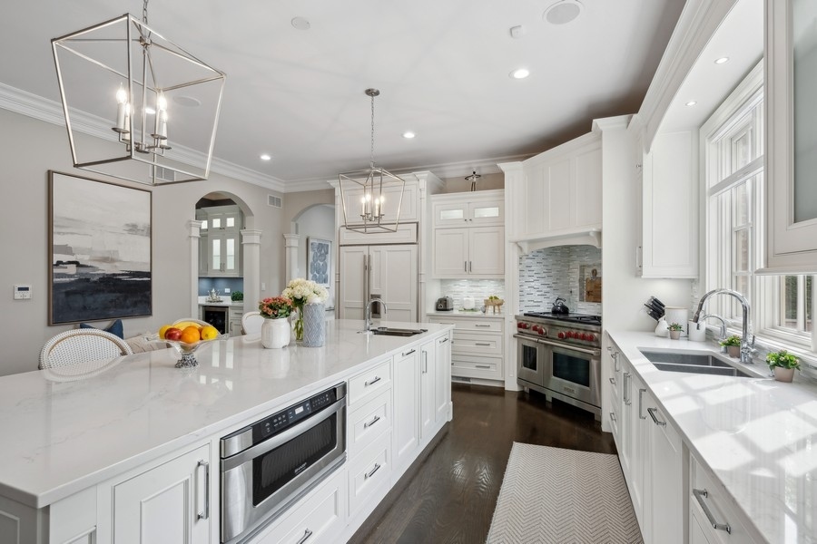 2 Bristol Road Northfield, IL 60093 - Photo 8 of 52 a kitchen with stainless steel appliances a sink stove and refrigerator
