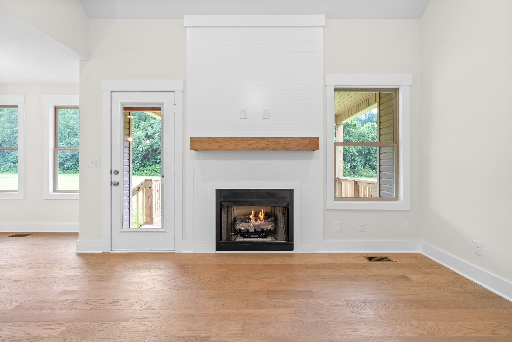 1928 Flats Road Cunningham, TN 37052 - Photo 11 of 49 an empty room with windows and fireplace