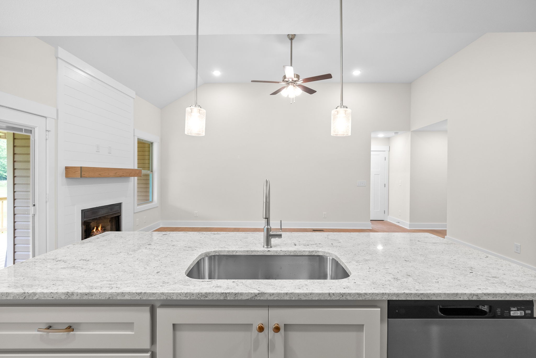 1928 Flats Road Cunningham, TN 37052 - Photo 19 of 49 a kitchen with a sink a counter space and a fireplace
