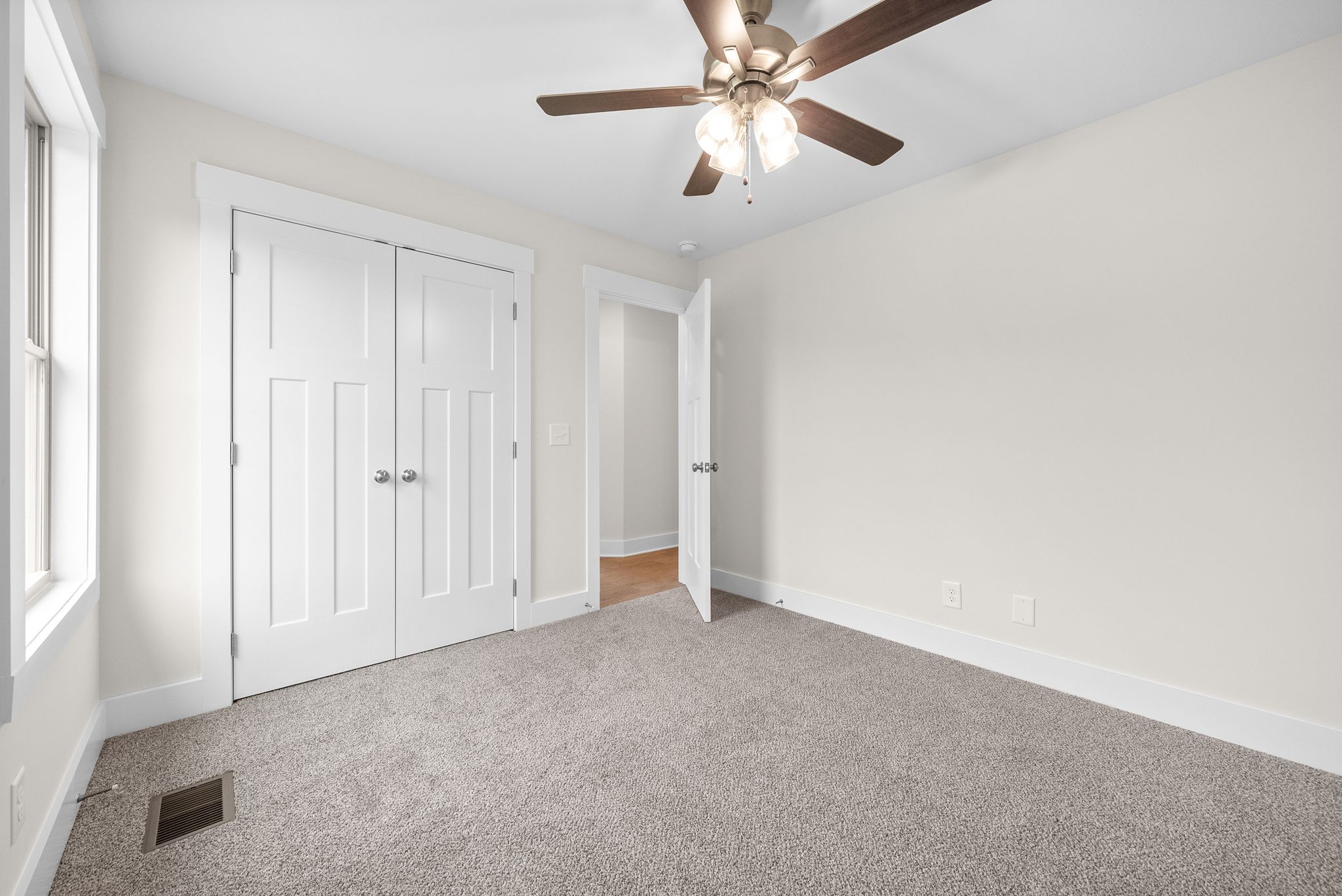 1928 Flats Road Cunningham, TN 37052 - Photo 33 of 49 an empty room with closet and a chandelier fan