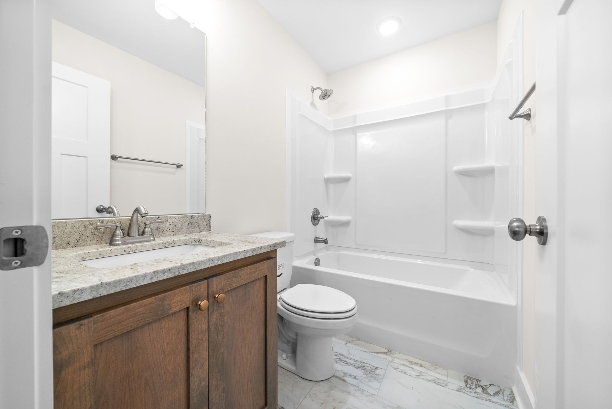 1928 Flats Road Cunningham, TN 37052 - Photo 34 of 49 a bathroom with a granite countertop sink toilet mirror and shower