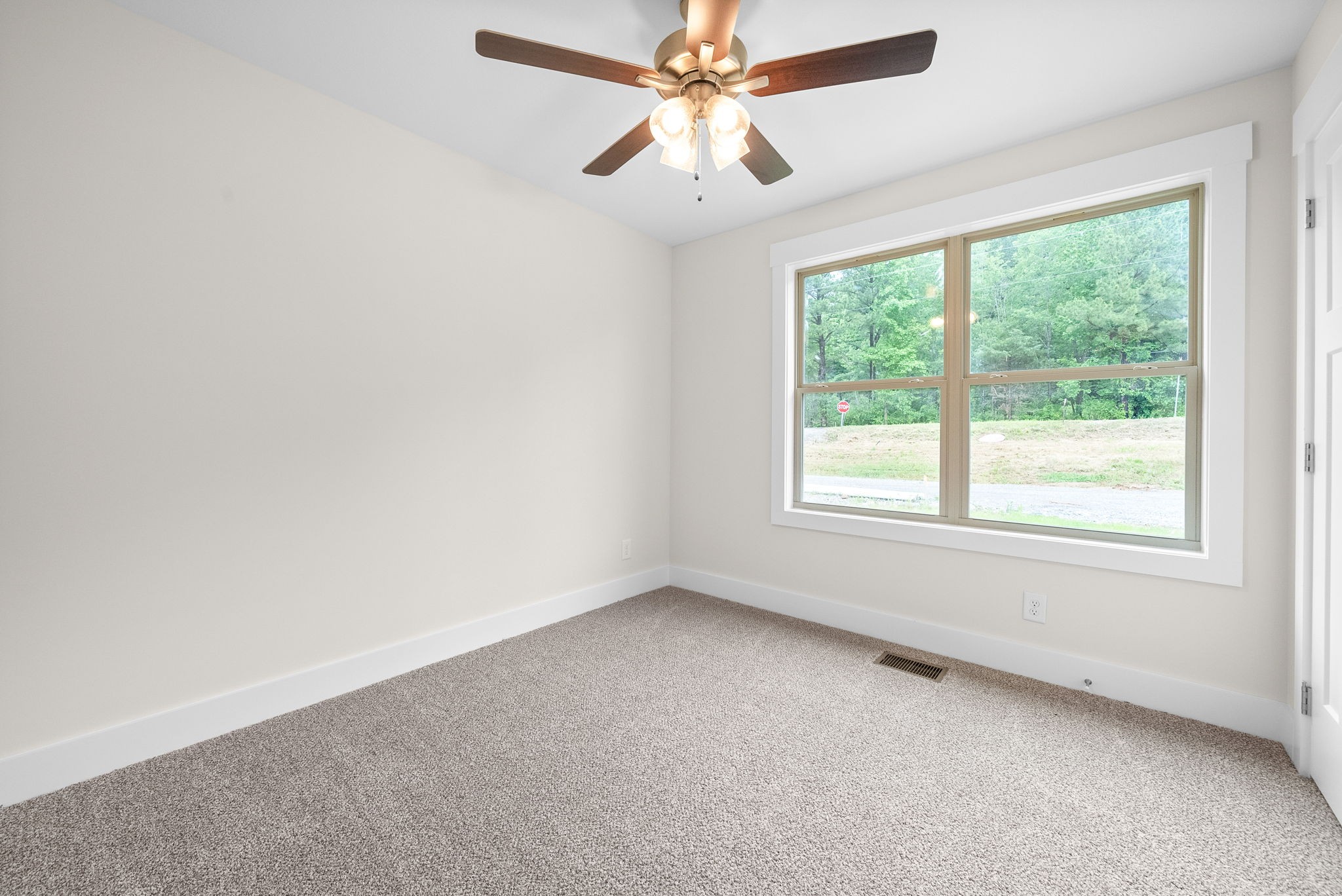 1928 Flats Road Cunningham, TN 37052 - Photo 35 of 49 an empty room with a window and a fan