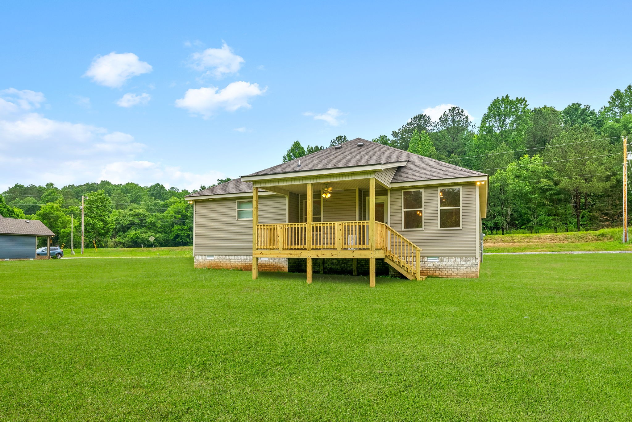 1928 Flats Road Cunningham, TN 37052 - Photo 39 of 49 a view of a house with a yard and sitting area