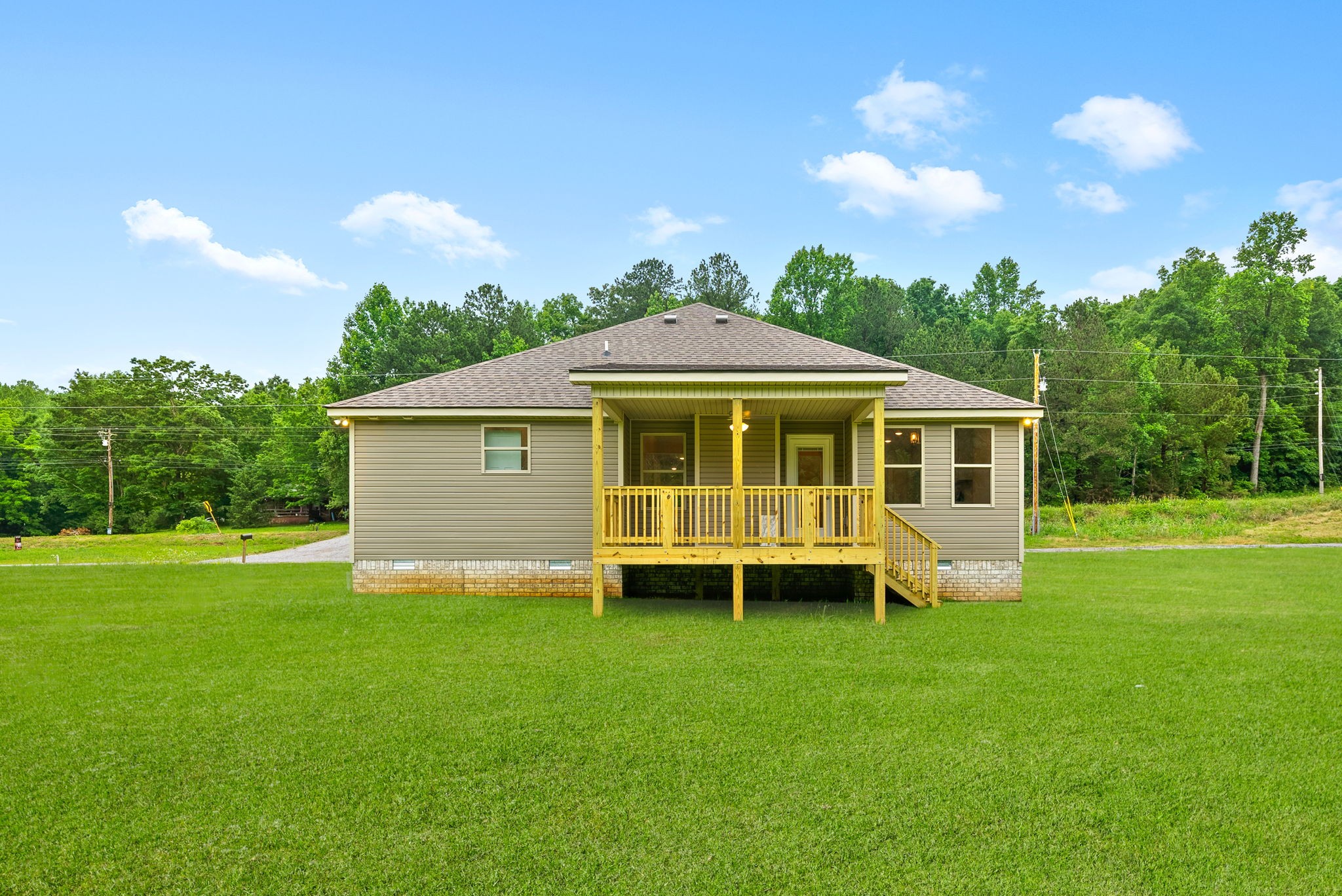 1928 Flats Road Cunningham, TN 37052 - Photo 40 of 49 a view of a house with a yard