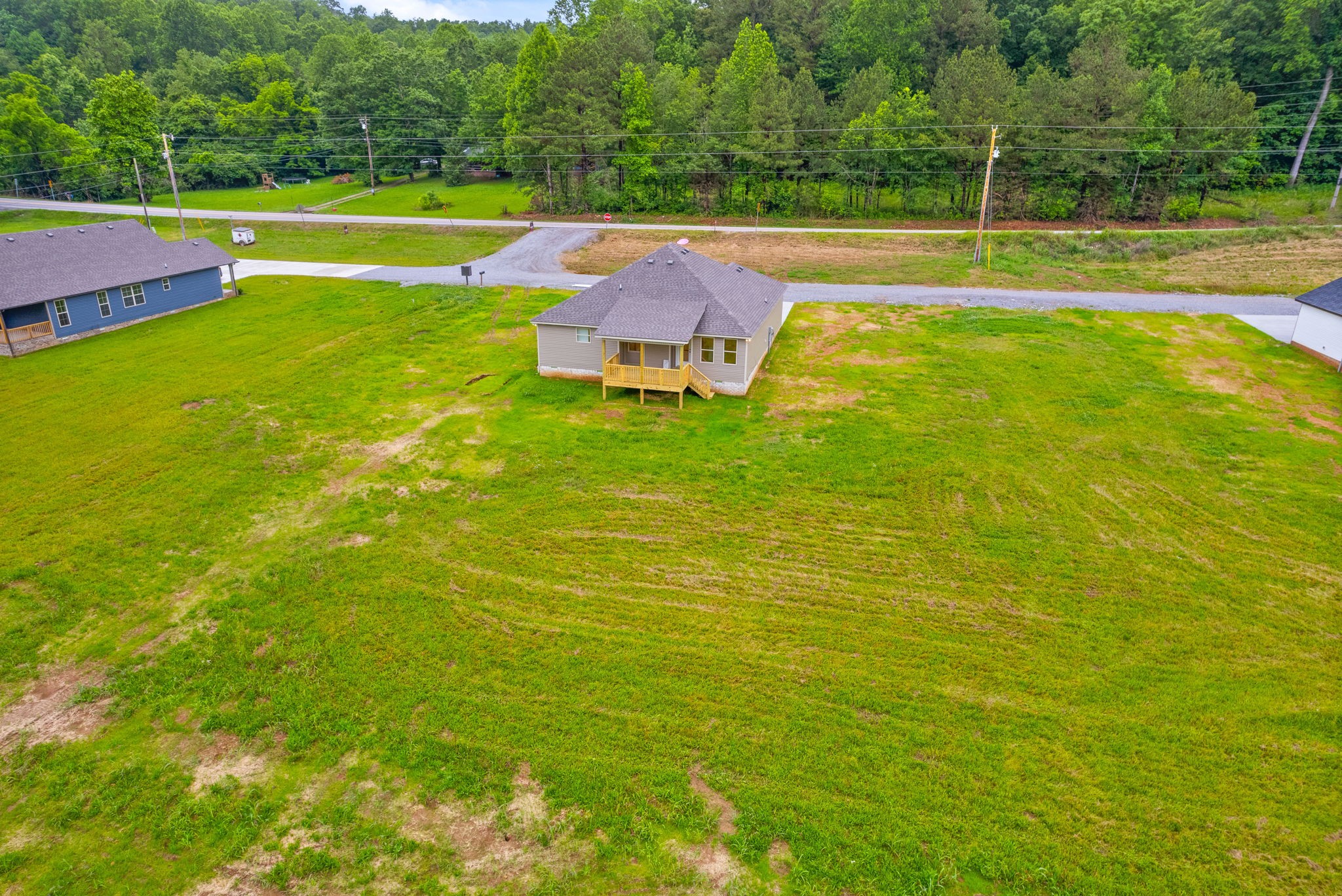 1928 Flats Road Cunningham, TN 37052 - Photo 46 of 49 a view of a swimming pool with a yard and a large tree