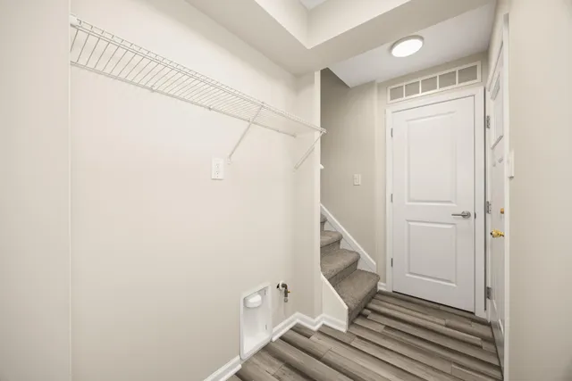 a view of a hallway with staircase