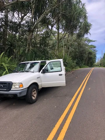 a view of a car parked in back of a house