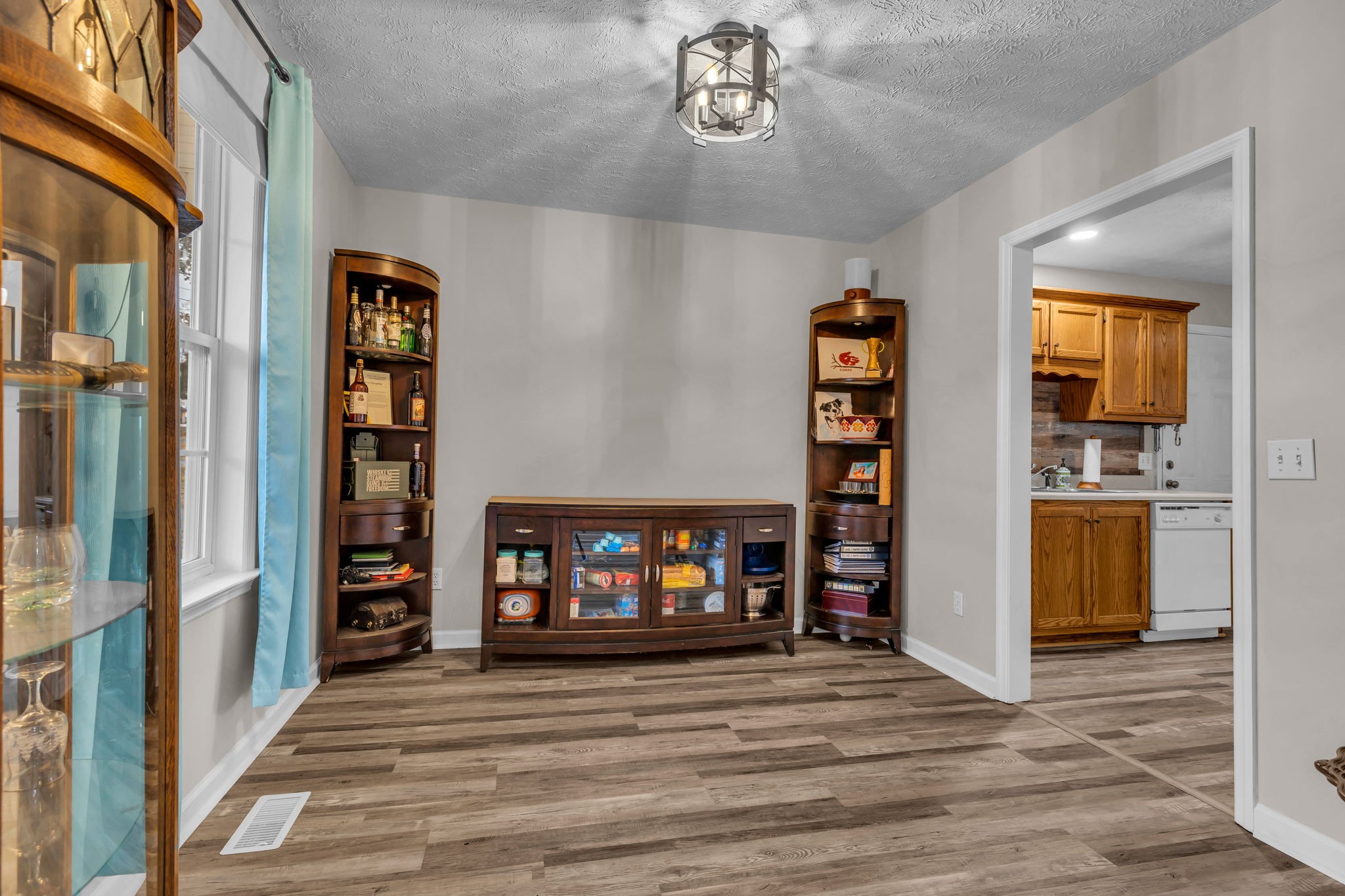 493 Goshen Road Lebanon, TN 37087 - Photo 11 of 29 a view of a hallway with wooden floor and a living room