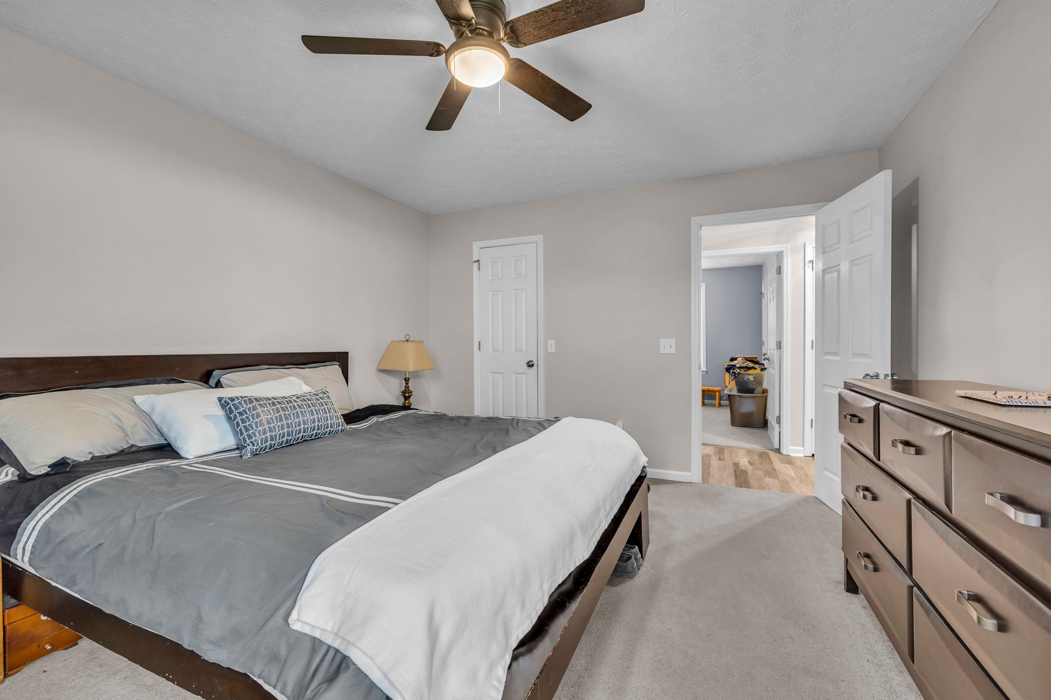 493 Goshen Road Lebanon, TN 37087 - Photo 17 of 29 a bedroom with a bed and a chandelier