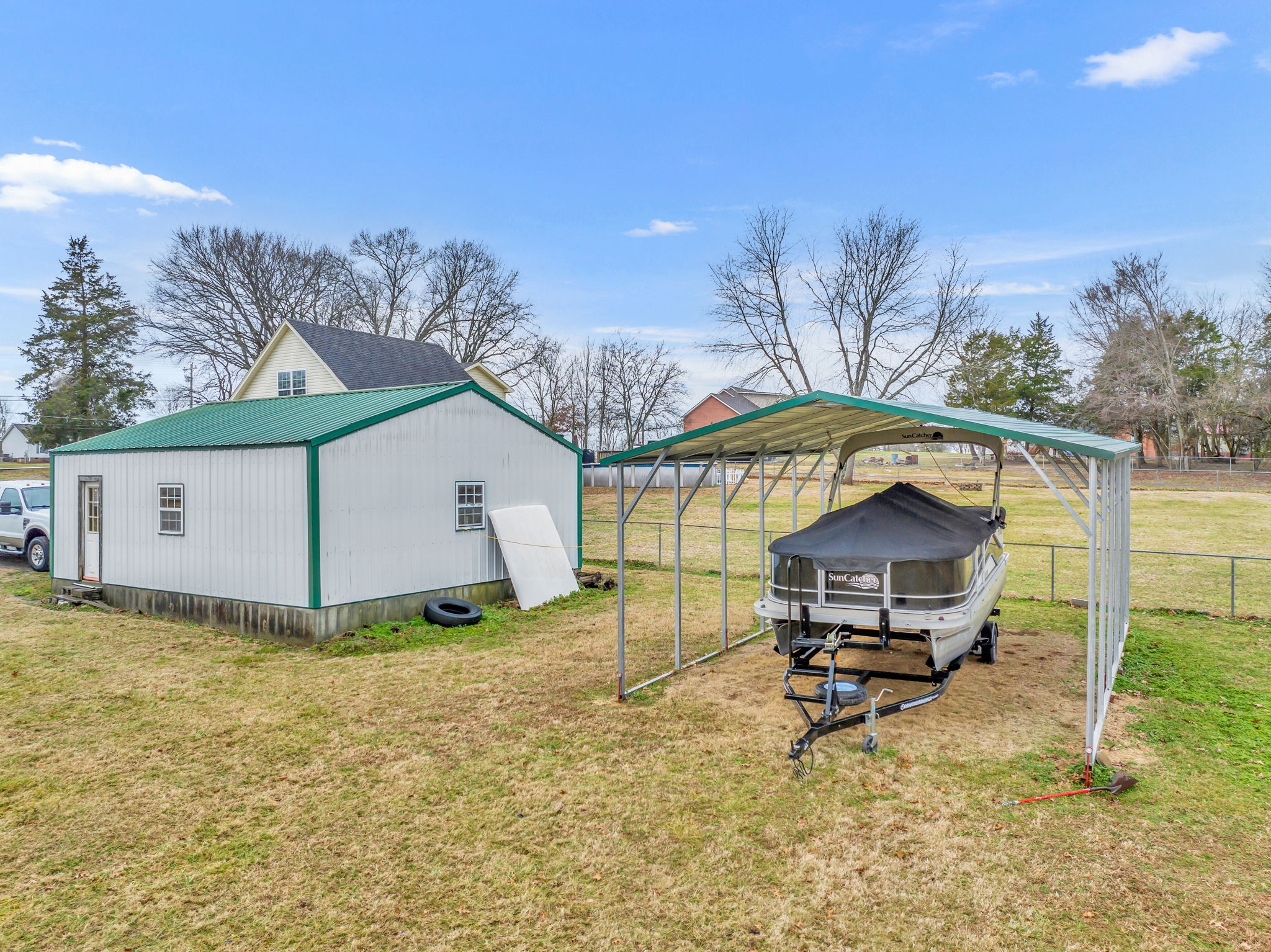493 Goshen Road Lebanon, TN 37087 - Photo 27 of 29 a house view with a bench and trees in the background