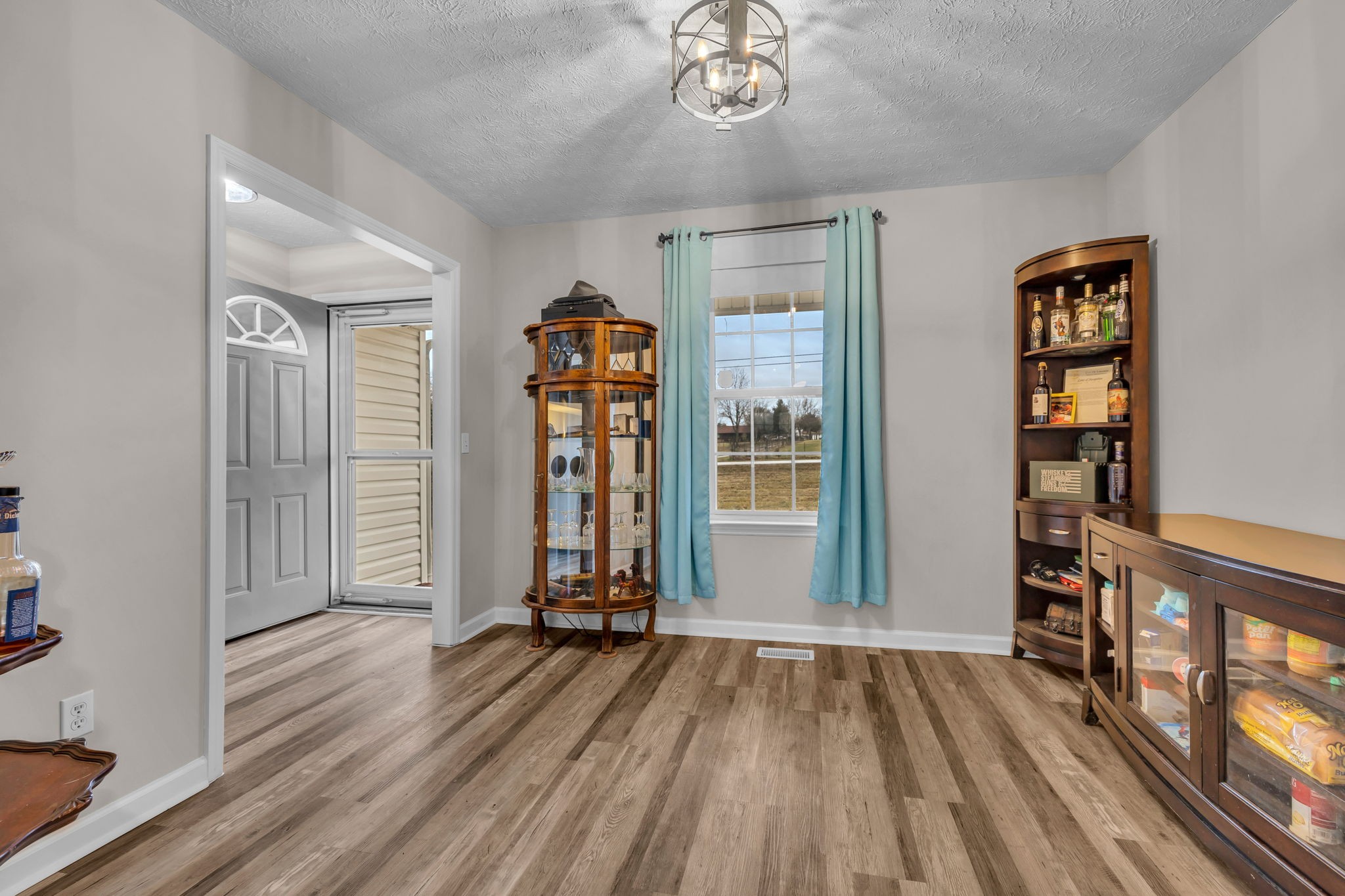 493 Goshen Road Lebanon, TN 37087 - Photo 10 of 29 wooden floor in an empty room with a window