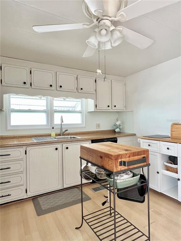 1100 South Belcher Road, Unit 57 Largo, FL 33771 - Photo 12 of 59 a kitchen with a stove cabinets and window