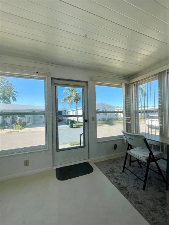 1100 South Belcher Road, Unit 57 Largo, FL 33771 - Photo 36 of 59 a living room with furniture and a window