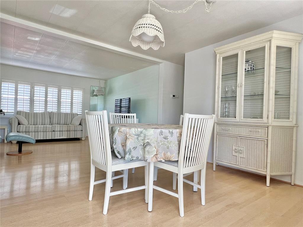 1100 South Belcher Road, Unit 57 Largo, FL 33771 - Photo 8 of 59 a dining room with furniture and window