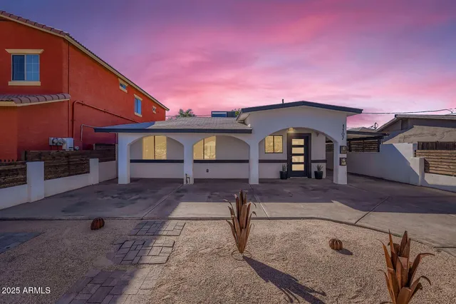 a front view of a house with garden