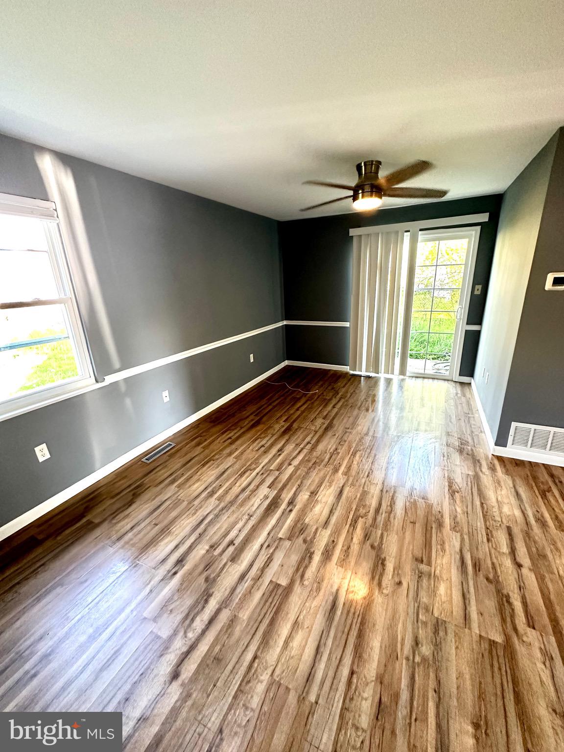 326 Brandon Drive Bear, DE 19701 - Photo 4 of 16 wooden floor in an empty room with a window