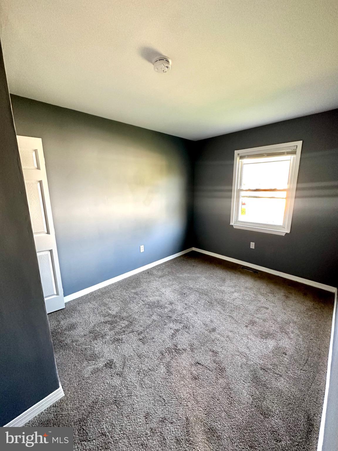 326 Brandon Drive Bear, DE 19701 - Photo 6 of 16 an empty room with a window