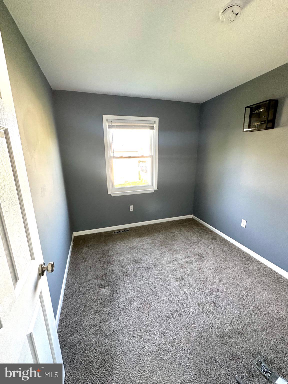 326 Brandon Drive Bear, DE 19701 - Photo 8 of 16 an empty room with windows