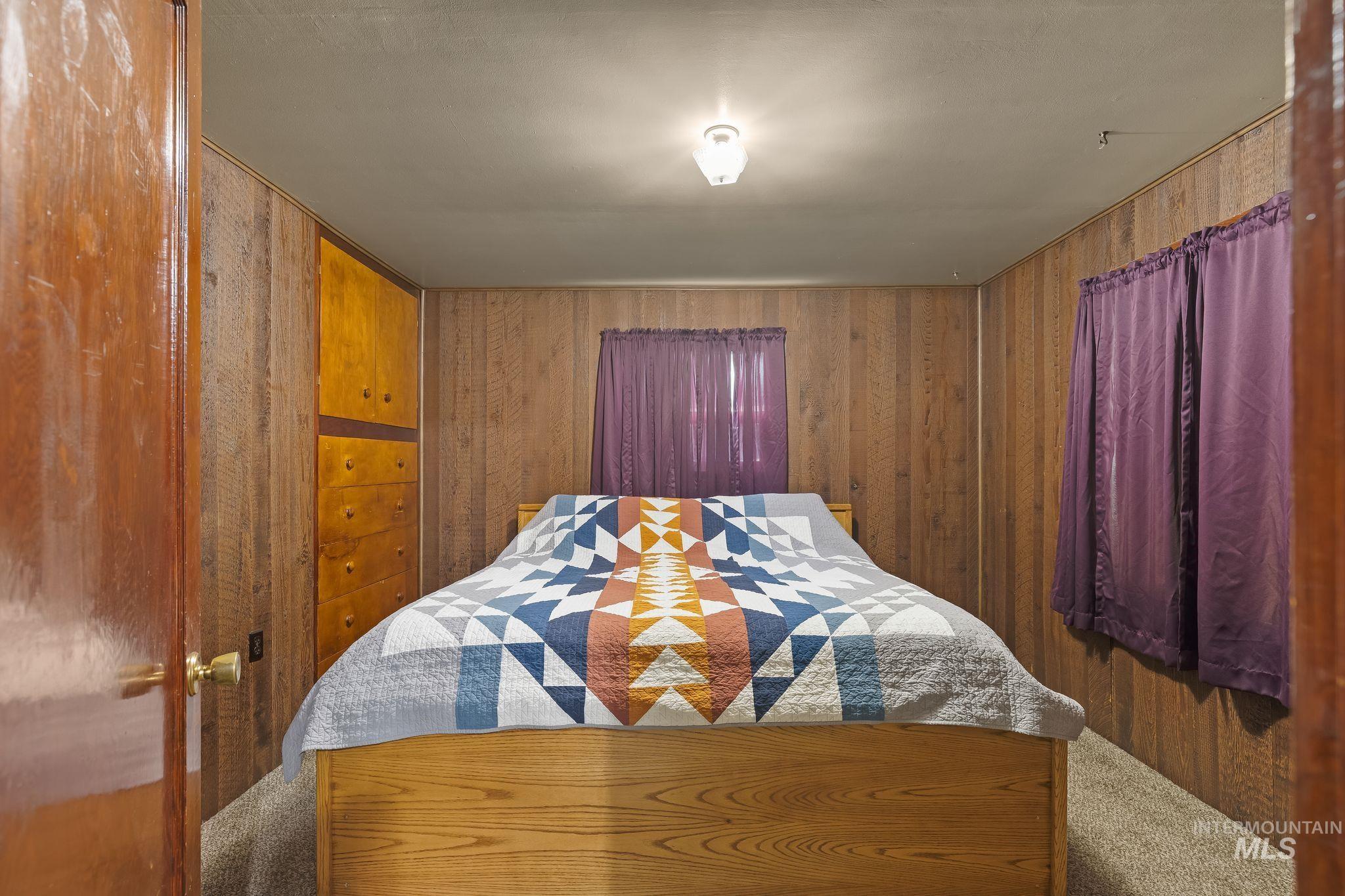 2255 Appleside Boulevard Clarkston, WA 99403 - Photo 21 of 41 Room featuring wood-look paneling and neutral carpeting