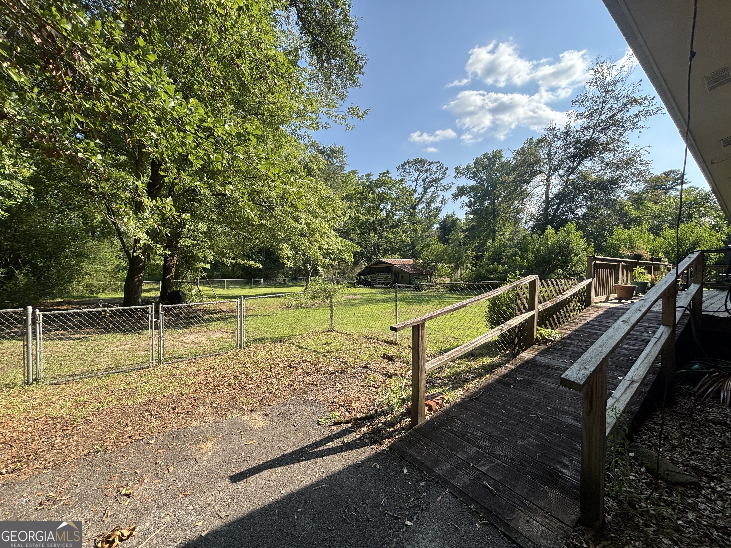 152 Crest Drive Cochran, GA 31014 - Photo 50 of 54 a view of a backyard with trees