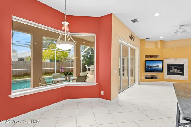 a kitchen with stainless steel appliances kitchen island granite countertop a refrigerator and a sink