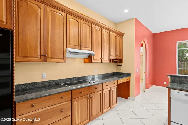 a dining room with a table and chairs