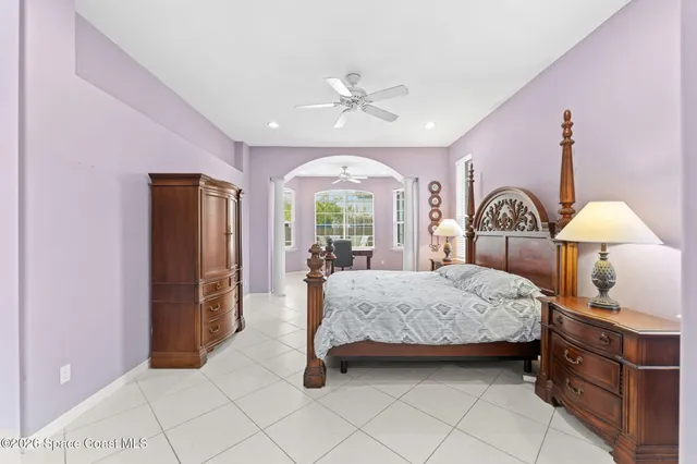a view of a livingroom with workspace and a window
