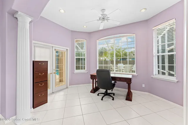 a spacious bathroom with a granite countertop tub sink shower and mirror