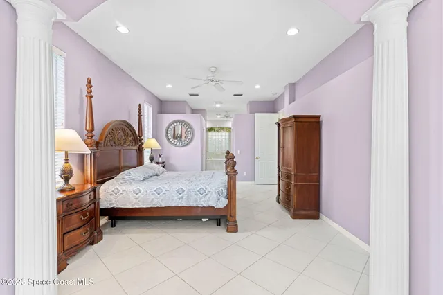 a spacious bathroom with a tub shower and a sink