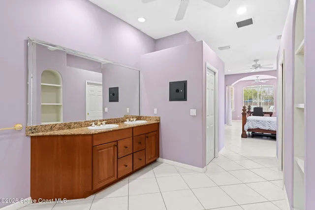 a kitchen with stainless steel appliances kitchen island granite countertop a stove top oven a sink a dining table and chairs