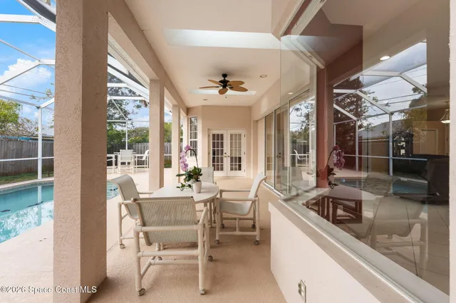 a view of a house with a backyard and a patio