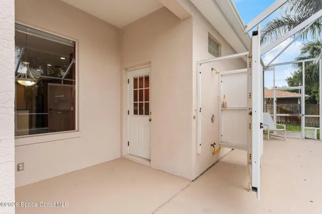 an aerial view of a house with outdoor space and lake view