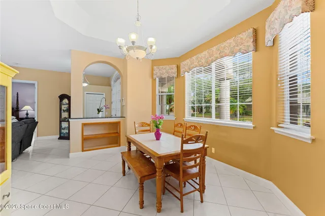 a lobby with furniture and large windows