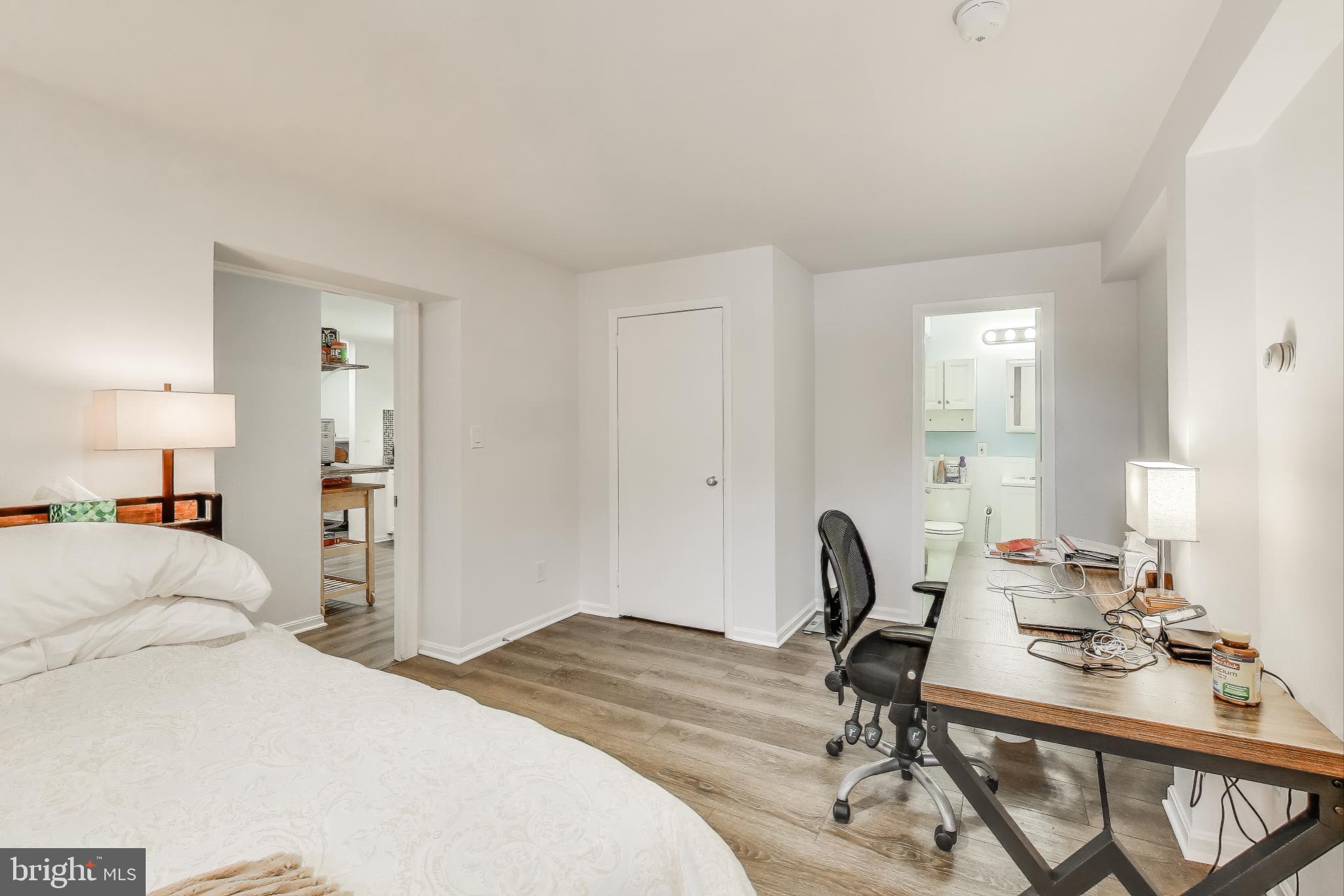 3100 North Glebe Road Arlington, VA 22207 - Photo 62 of 101 a bedroom with a bed a desk and chair