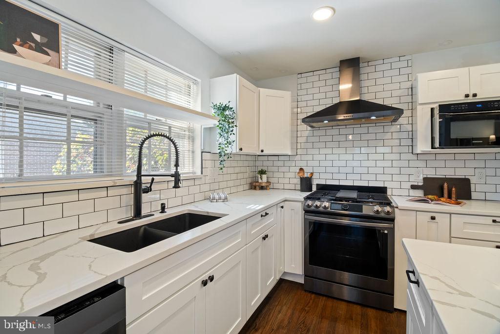 3100 North Glebe Road Arlington, VA 22207 - Photo 10 of 101 a kitchen with a sink stove top oven and cabinets