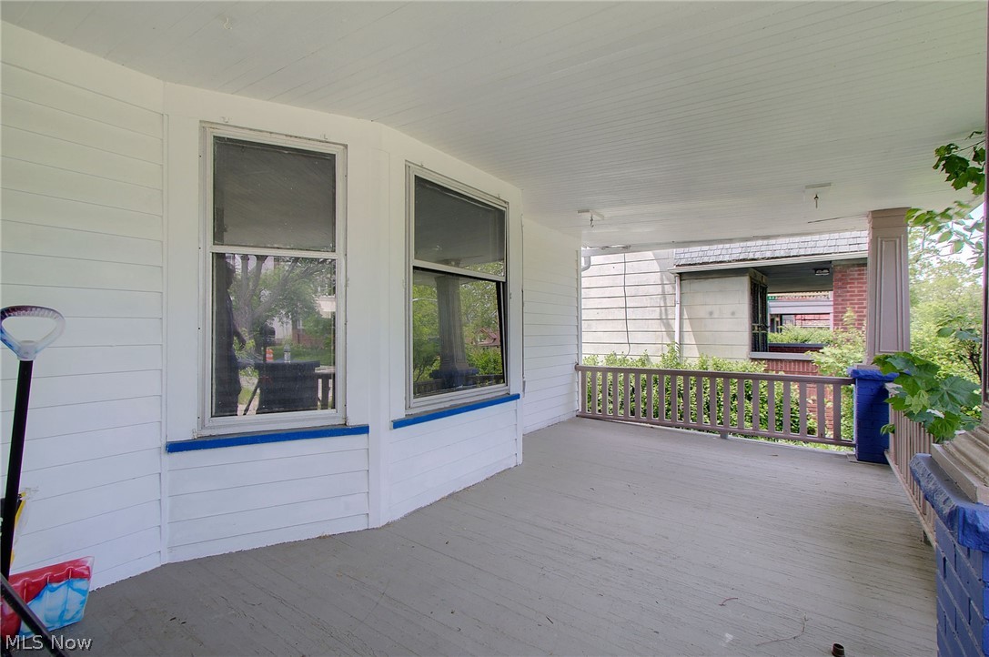 1872 Lampson Road Cleveland, OH 44112 - Photo 21 of 21 Covered front porch featuring a wood-finish floor and white paneled walls