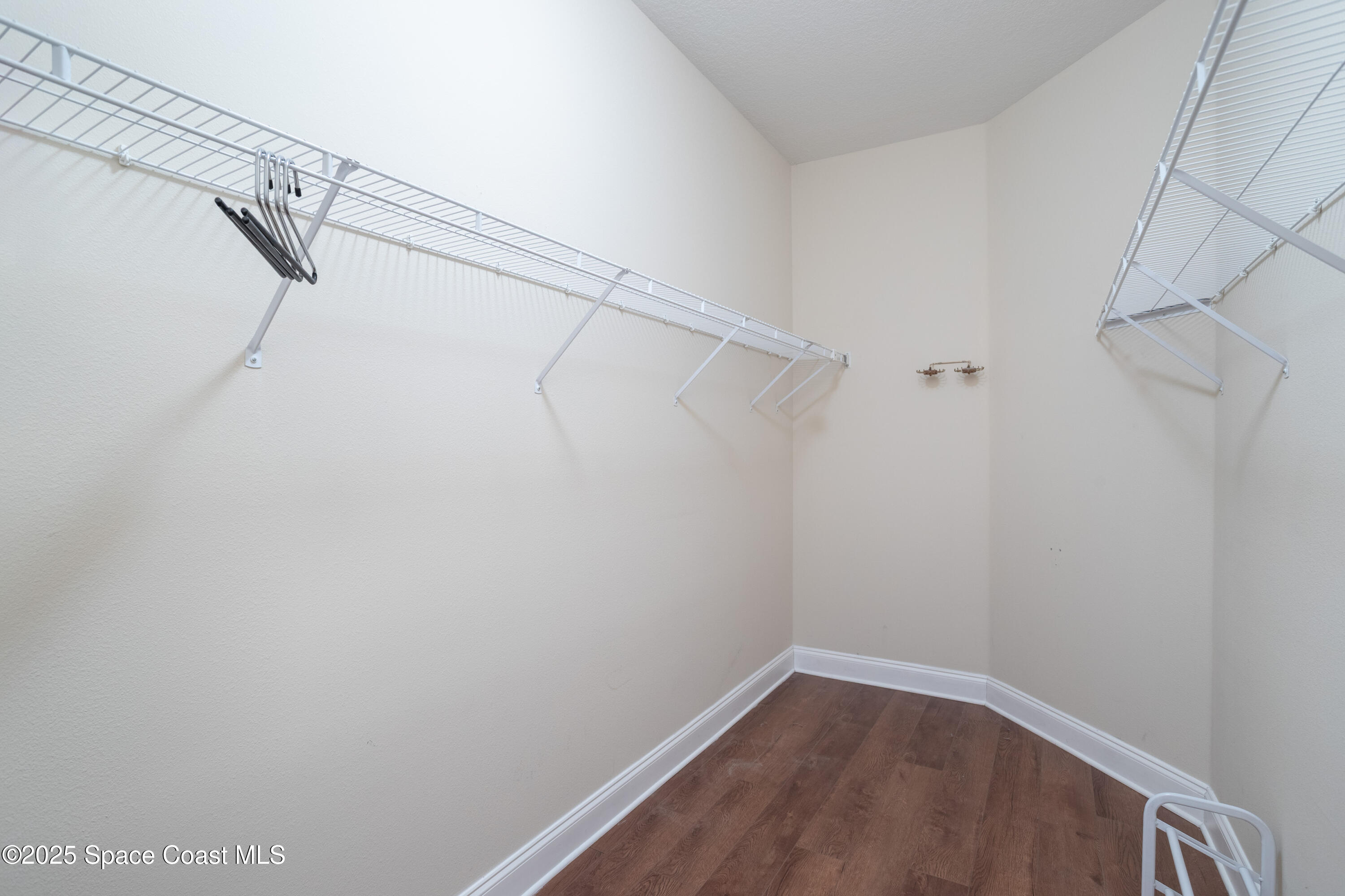 3029 Vallejo Way Melbourne, FL 32940 - Photo 15 of 26 a view of a room with racks on the wall