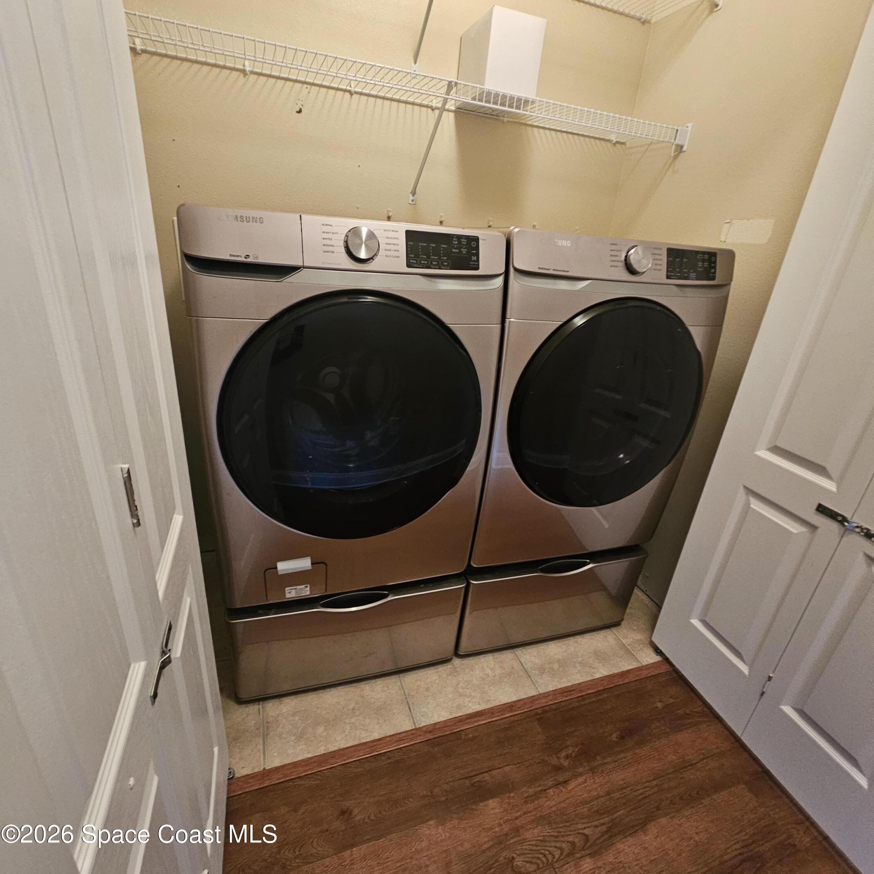 3029 Vallejo Way Melbourne, FL 32940 - Photo 19 of 26 a utility room with dryer and washer