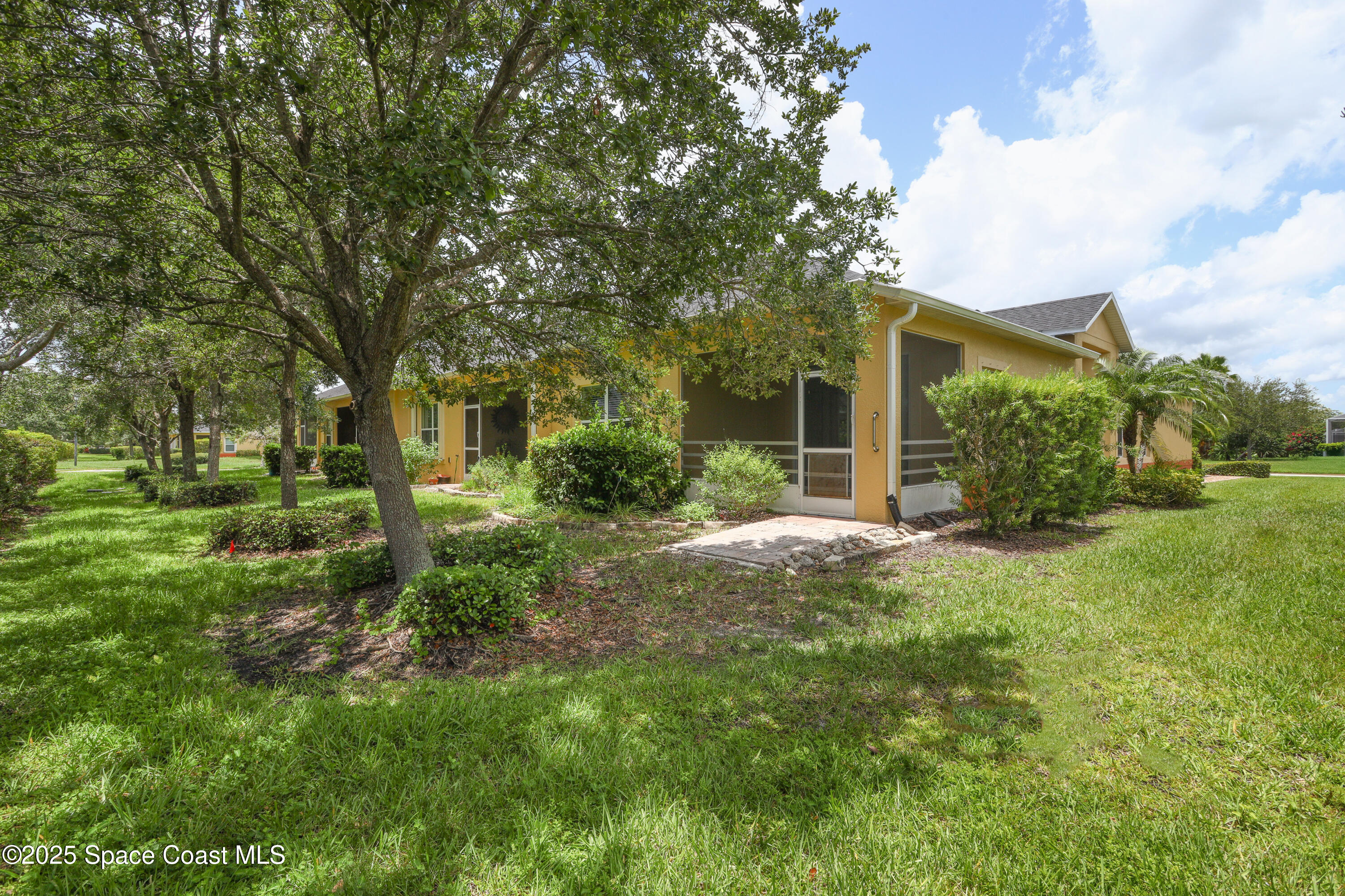 3029 Vallejo Way Melbourne, FL 32940 - Photo 23 of 26 a view of a house with a backyard