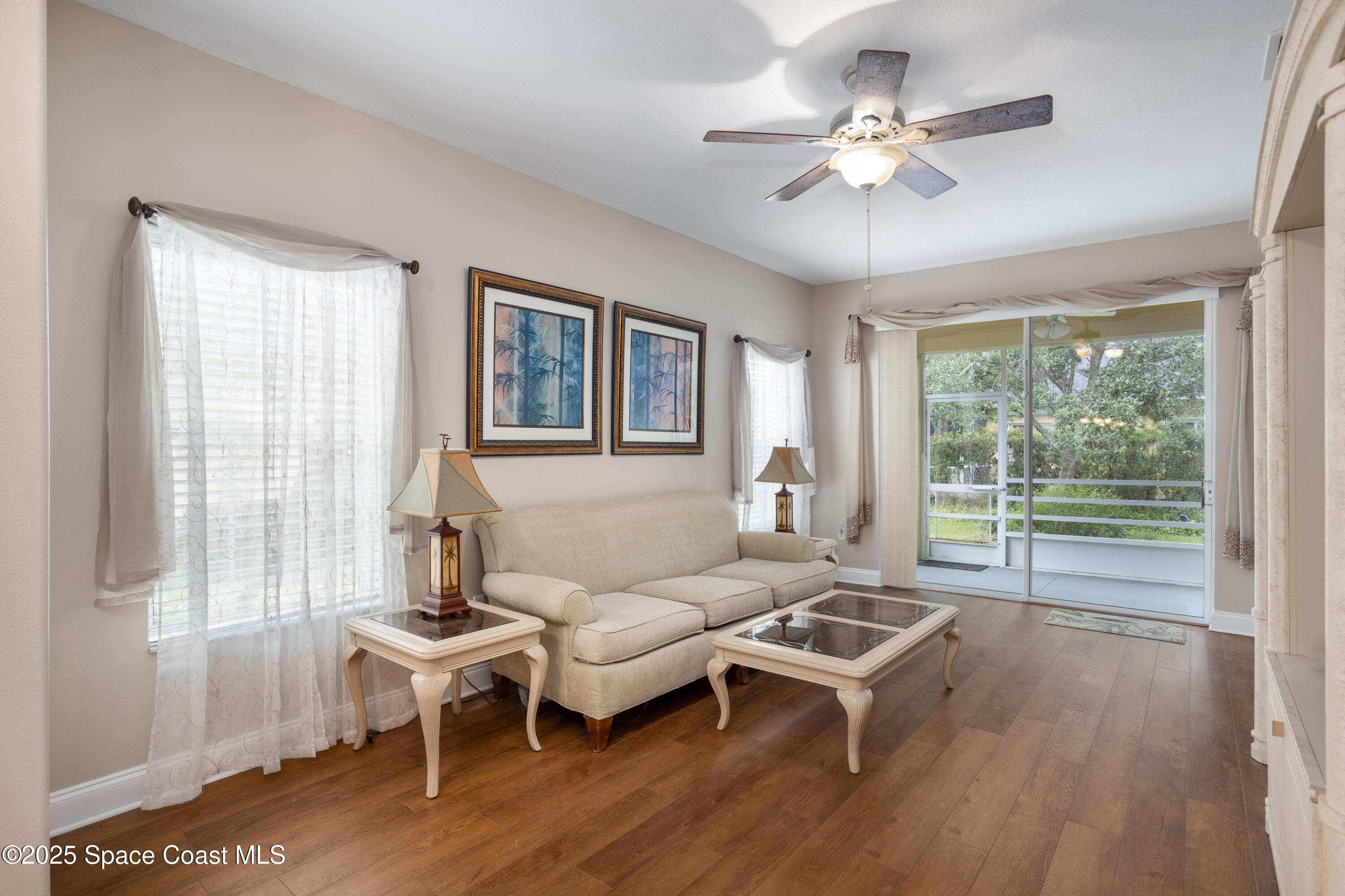 3029 Vallejo Way Melbourne, FL 32940 - Photo 9 of 26 a living room with furniture a table and a large window