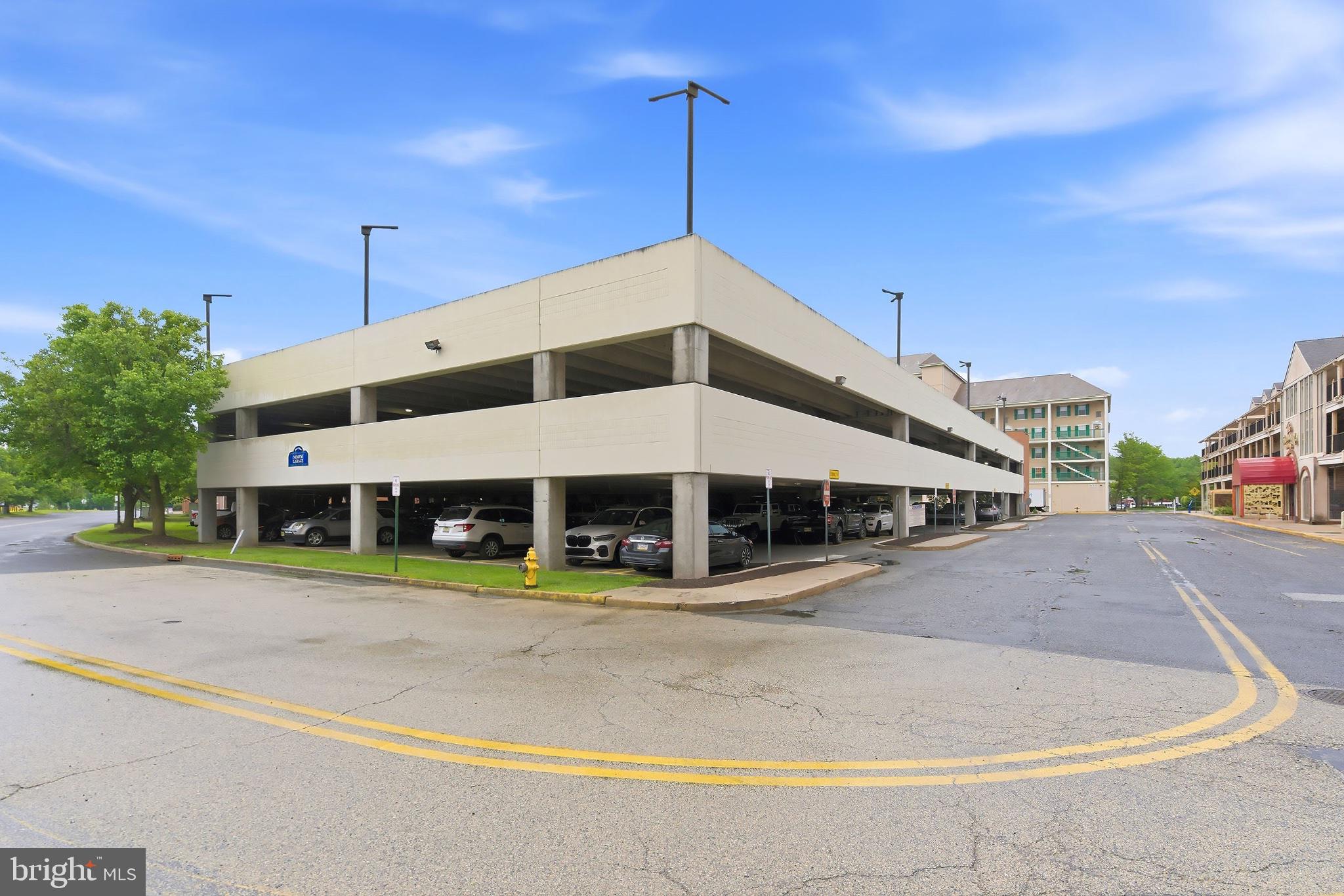 3036 Main Street, Unit 3036 Voorhees, NJ 08043 - Photo 21 of 24 Modern parking structure with greenery.