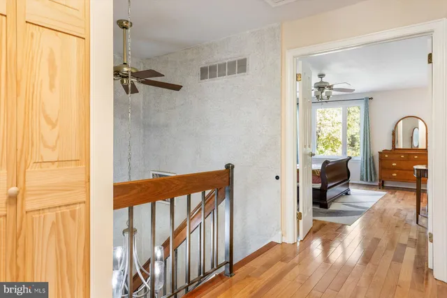 a view of a hardwood floor and an entryway